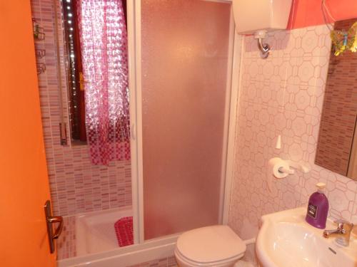 a bathroom with a toilet and a sink and a shower at B&B Figli Dei Fiori in Realmonte