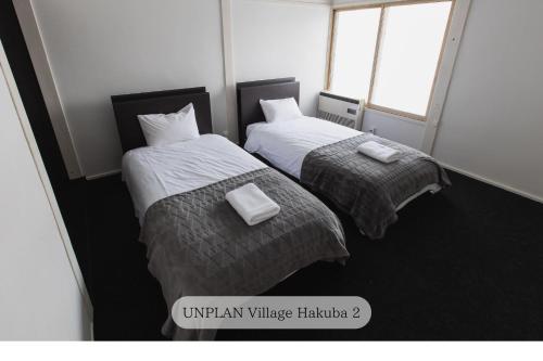 UNPLAN Village Hakubaにあるベッド