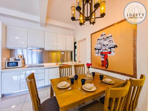 a kitchen and dining room with a wooden table and chairs at Pangsapuri Meridian by RR JBcity in Nusajaya