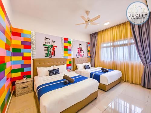 a bedroom with two beds and a colorful wall at Pangsapuri Meridian by RR JBcity in Nusajaya