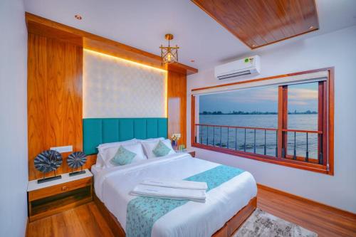Katil atau katil-katil dalam bilik di Beach Paradise Day Cruise Houseboat