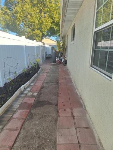 an empty sidewalk in front of a building at Private Studio in Kissimmee