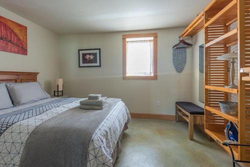 a bedroom with a bed and a window at Cozy Spa Sanctuary - Steps to Restaurants and Shopping in Portland