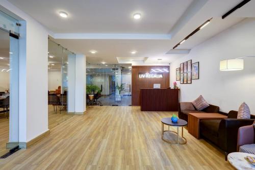 an office lobby with a couch and a table at 1BHK Suites Opp Marriott - Huda City Centre in Gurgaon