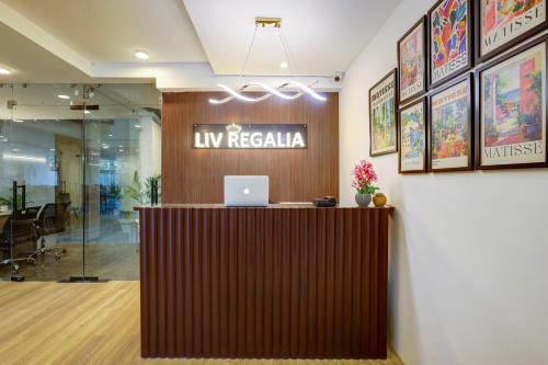 an office lobby with a desk with a laptop on it at 1BHK Suites Opp Marriott - Huda City Centre in Gurgaon
