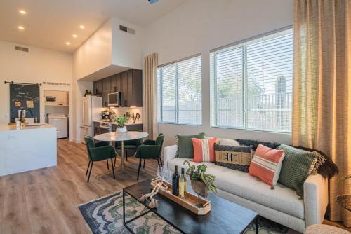 a living room with a couch and a table at Phoenix Stay , Near Mayo Clinic & Shopping, Pool & Parking- S134 in Scottsdale