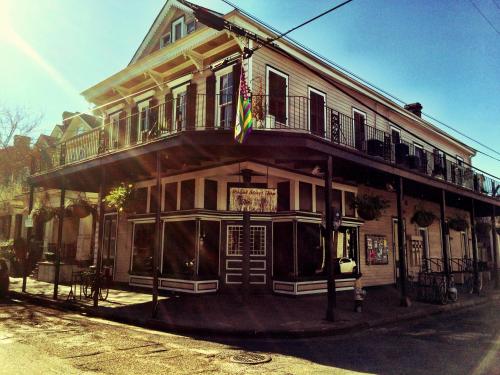 a building with a flag on the front of it at Royal Street Inn & Bar in New Orleans