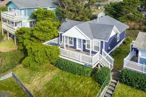 an aerial view of a large blue and white house at Harbor Lights in Lincoln City