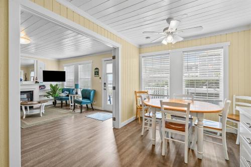 a dining room and living room with a table and chairs at Harbor Lights in Lincoln City