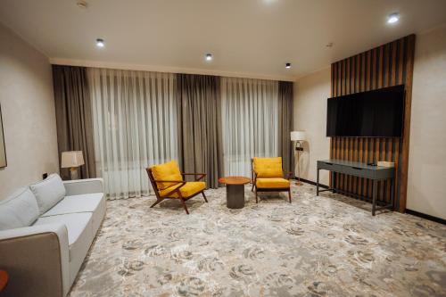 Телевизор и/или развлекательный центр в Aurum Garden Hotel