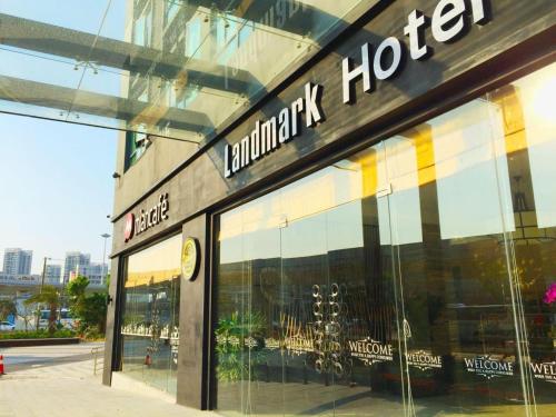 a store front of a building with glass windows at Landmark Hotel in Zhuhai