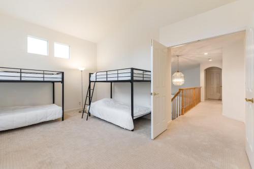 two bunk beds in a room with a hallway at Affordable Dorm SSF in South San Francisco