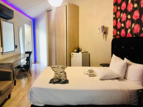 Postel nebo postele na pokoji v ubytování Lodge Bellagio