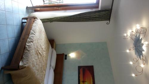 Katil atau katil-katil dalam bilik di Agriturismo Mare e Monti