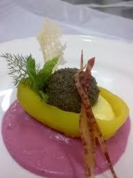 a plate of food with a banana on a purple sauce at Palazzo dei Poeti in Tursi