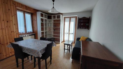 a dining room with a table and some chairs at LinHaus in Limone Piemonte