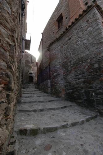 an alley in an old stone building at Palazzo dei Poeti in Tursi