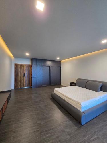 a large bedroom with a large bed in it at Live Specialty House in Ban Wang Pong