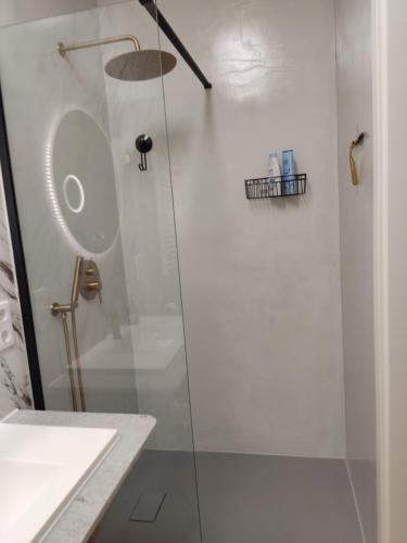 a bathroom with a shower with a glass door at BellaCaro in Löhne