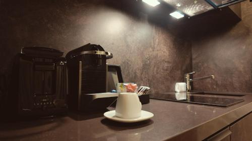 a coffee maker sitting on a counter in a kitchen at Bellman Hotel in Berlin