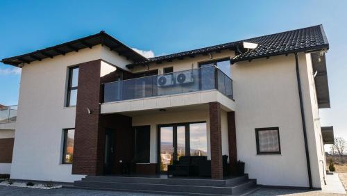 a house with the number on it at Casa Ambientt in Curtea de Argeş