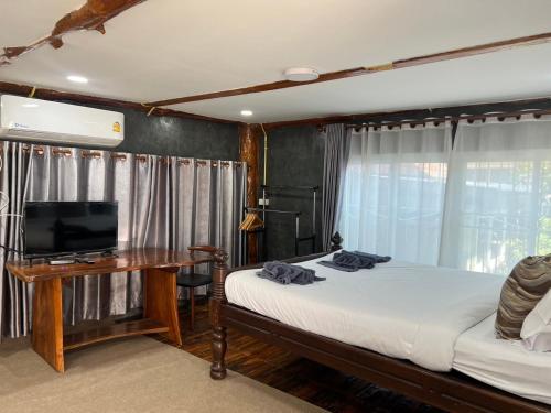 TV a/nebo společenská místnost v ubytování Sor Boutique Resort Chiangrai