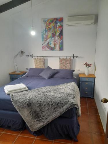 a bedroom with a bed with a blanket on it at Mijaa pueblo Paradise villa anex in Mijas