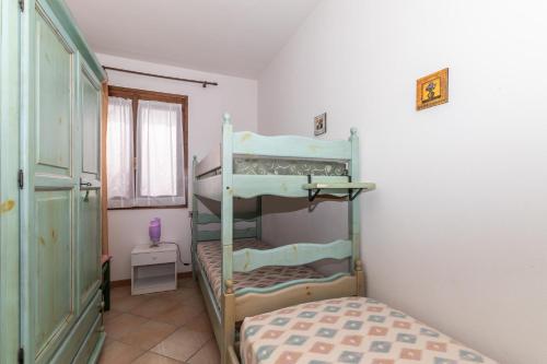Posteľ alebo postele v izbe v ubytovaní Appartamento Primula