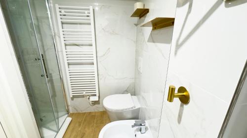 a bathroom with a toilet and a glass shower at Ca' Egle by Ca-Sa Check in Chioggia