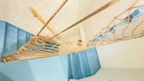 a net hanging from a ceiling in a room at Ca' Egle by Ca-Sa Check in Chioggia