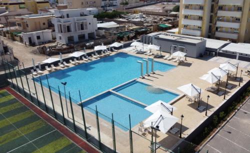 an overhead view of a swimming pool in a city at WAAFI CITY CENTER RESIDENCE in Djibouti