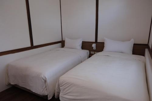 Ein Bett oder Betten in einem Zimmer der Unterkunft Machiya Posong