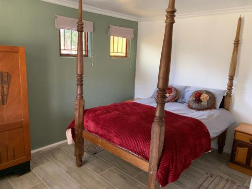 Ένα ή περισσότερα κρεβάτια σε δωμάτιο στο Die Boomhuis