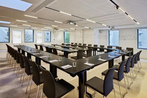 a large conference room with a long table and chairs at Courtyard by Marriott Paris Gare de Lyon in Paris