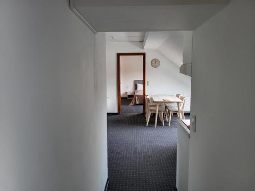 a hallway with a dining room and a table at Albergo City Hotel Berlin in Berlin