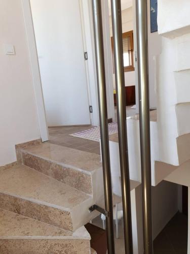 a set of stairs with stainless steel poles at Villa Sunrise in Izmir