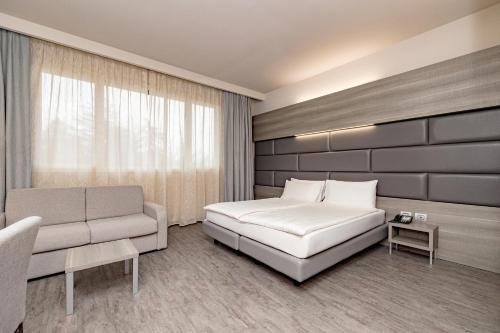 Postel nebo postele na pokoji v ubytování Just Hotel Saronno