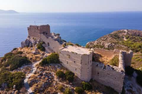 an old castle on the side of a mountain at AGROLOGY LUX - 4 BEDROOM Luxurious villa on an Agricultural Haven Retreat in Sálakos