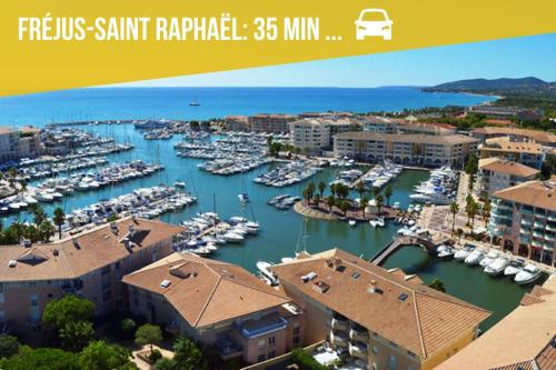 a view of a marina with boats in the water at Suite Moulin de la Calade -Tower View, Heart of Provence & AC in Le Luc