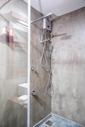 a shower with a glass door in a bathroom at Manta Beach Resort & Ayurvedic Wellness Centre in Galle