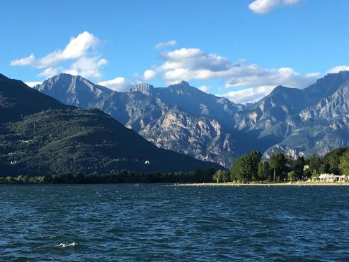 a large body of water with mountains in the background at La Casa del Nonno Franco in Colico