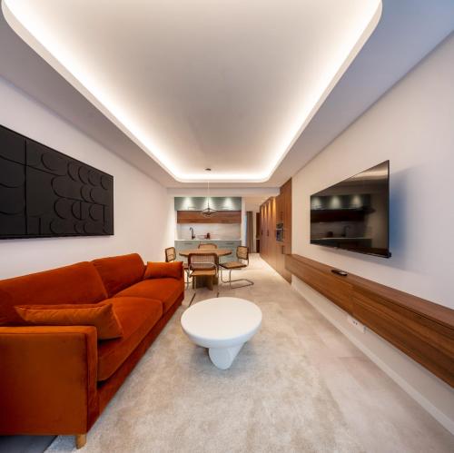 a living room with a couch and a table at Apartamentos Turísticos de Soria Centro NF in Soria