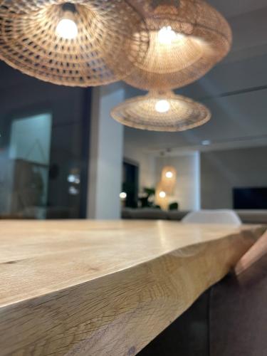 two lights hanging over a counter in a room at U NÁS DOMA v LUŽICÍCH in Lužice