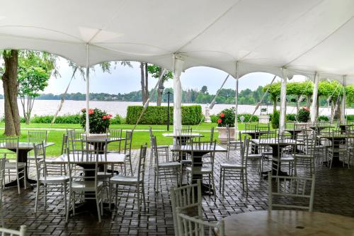 a group of tables and chairs under a white tent at Chateau Vaudreuil in Vaudreuil-Dorion