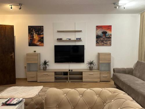 a living room with a flat screen tv at Apartmani Dalija in Sarajevo
