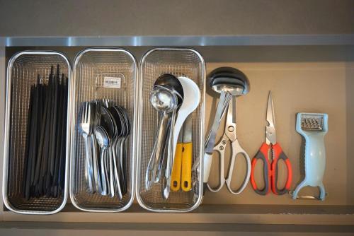 a drawer filled with utensils on a shelf at T-Plantino - Căn hộ Codotel The Sóng 5 Sao - Free swimmingpool, Gym, Sauna in Vung Tau