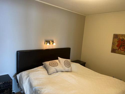 a bedroom with a bed with two pillows on it at Perfect location ski-in Åre in Åre