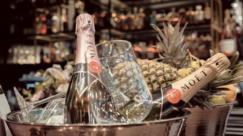 a bottle of wine in a bucket in a store at Bellman Hotel in Berlin