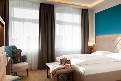 Postel nebo postele na pokoji v ubytování Hotel Ross