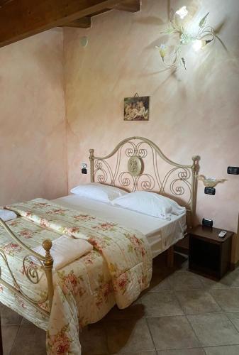 a bedroom with a bed in a room at Masseria Rosella - Longhi in Pietrelcina